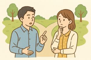 道の分岐点で立ち止まり比較する二人